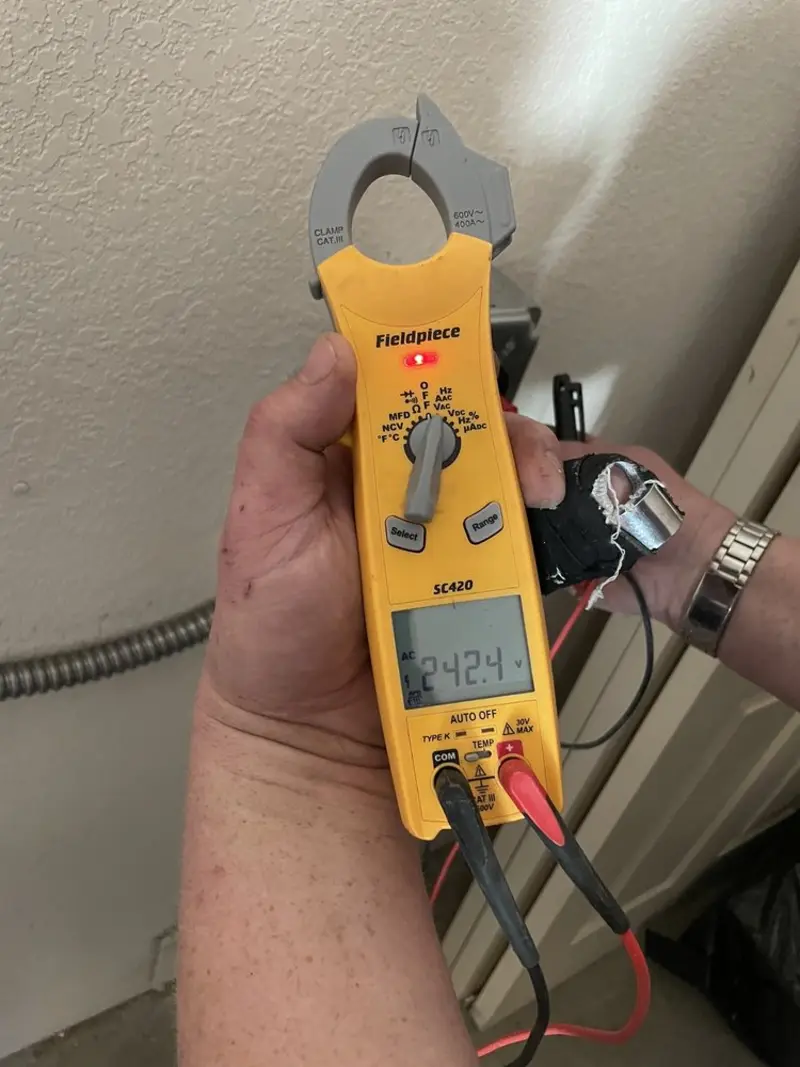 Voltage testing with clamp meter during Electrical Installation Services in New Britain
